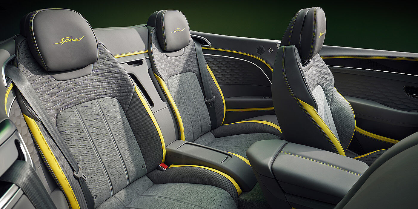 Bentley Jakarta Bentley New Continental GTC Speed convertible rear interior with unique Speed colour split in Gravity Grey and Cyber Yellow hide colours, and contrast stitched headrest emblems 