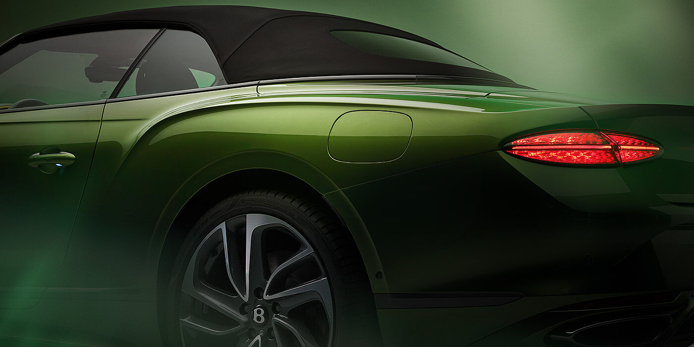 Bentley Jakarta Bentley New Continental GTC Speed rear haunch and tail lamp in Tourmaline Green paint and dark tint brightware with black hood up and illuminated head lamps