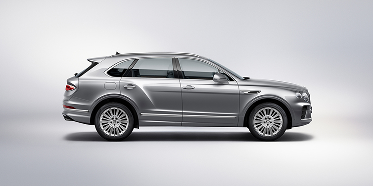 Bentley Jakarta Bentley Bentayga SUV side profile in Moonbeam silver paint against white background featuring 21 inch 5 spoke wheels